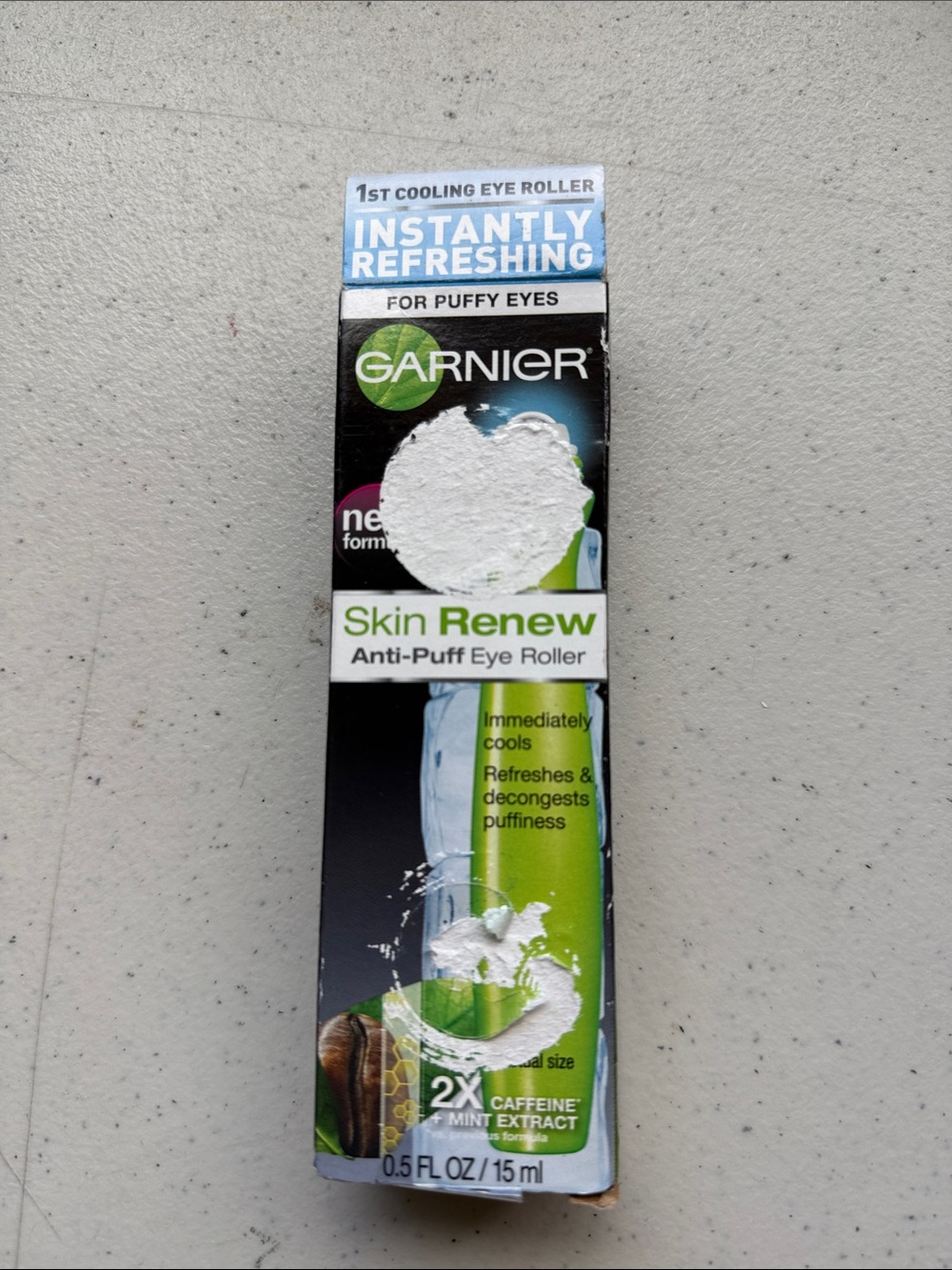 Garnier Skin Renew Anti-Puff Eye Roller - Green and White Packaging